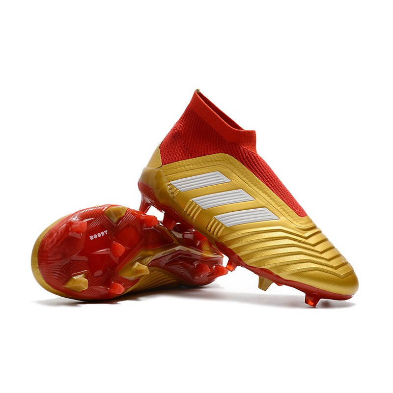 gold and red football cleats