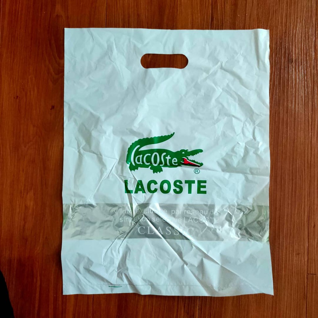 lacoste plastic logo