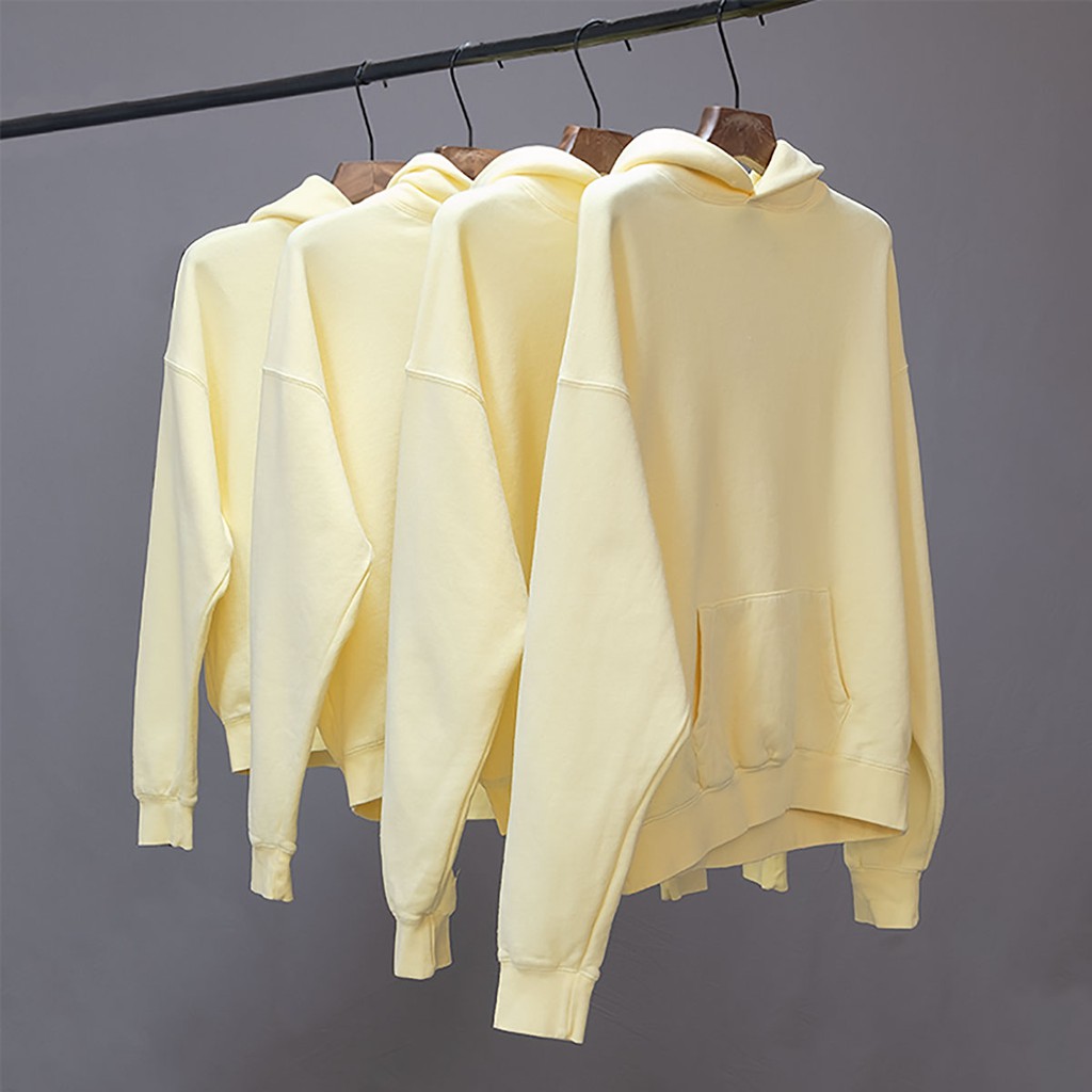 fear of god essentials hoodie yellow