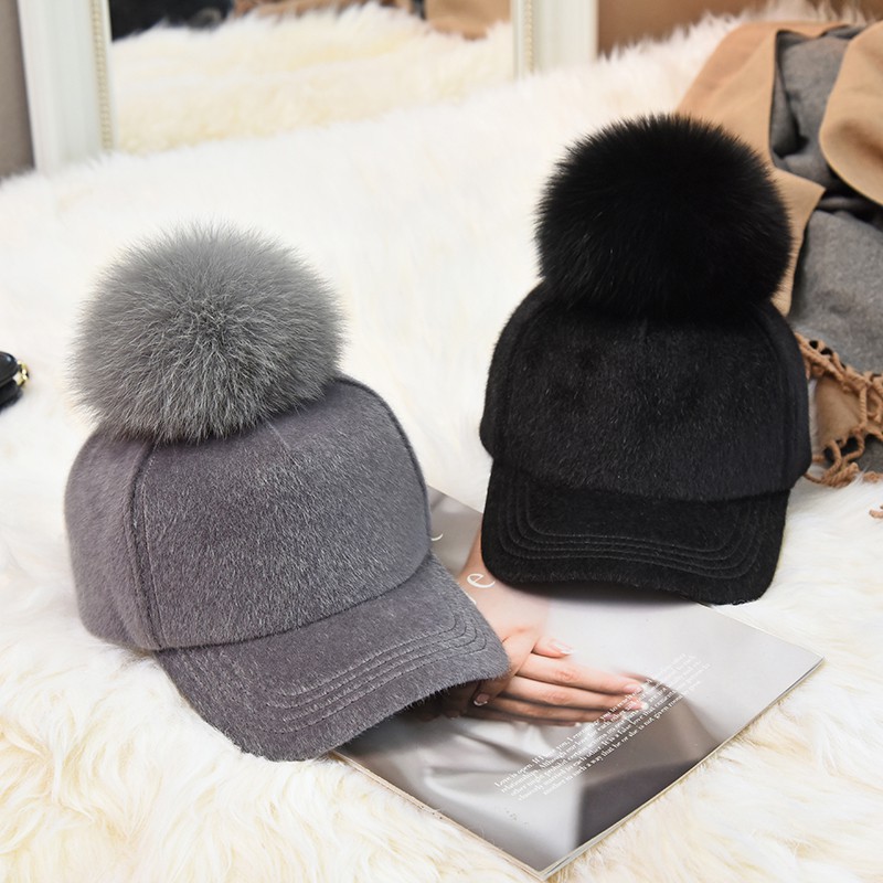 baseball hat with fur ball