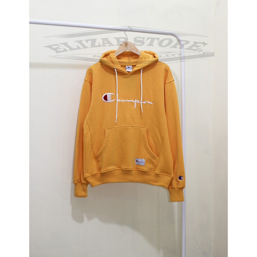 yellow champion hoodie with champion on sleeve