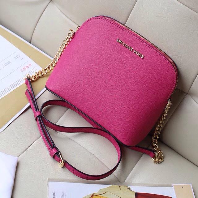 mk pink sling bag