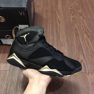 gold and black jordans 7