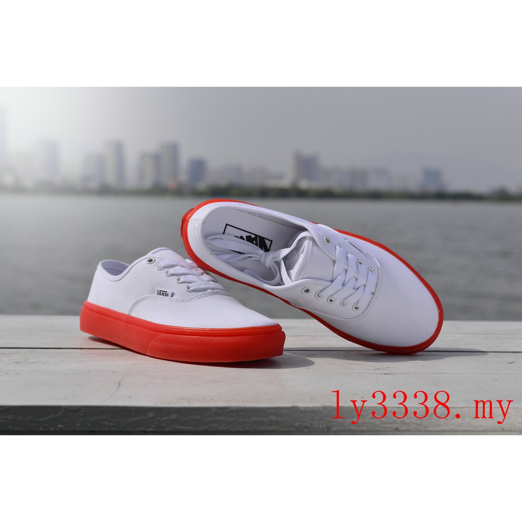 white vans with orange bottom