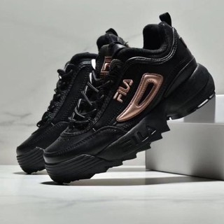 black and gold fila disruptor