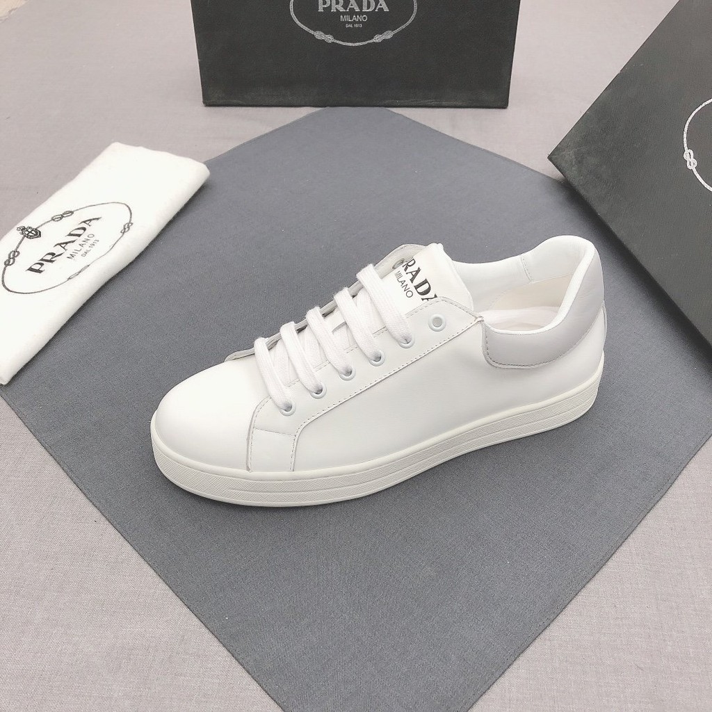 white leather low tops
