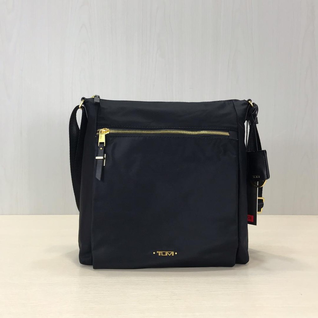 tumi ladies sling bag