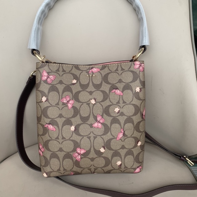 coach small town bucket bag butterfly