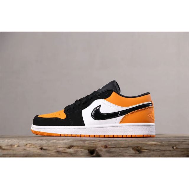 black and orange jordan 1 low