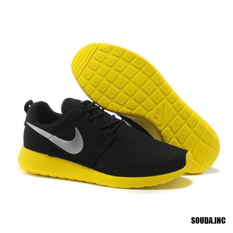 black and yellow nike running shoes