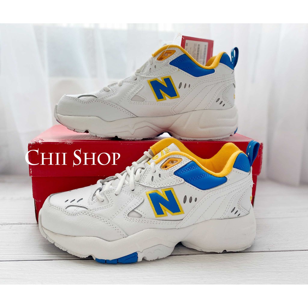 new balance 608 white with blue and yellow chunky trainers