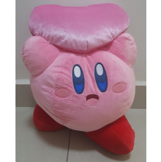 kirby holding heart plush