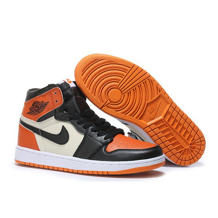 orange and black high top jordans