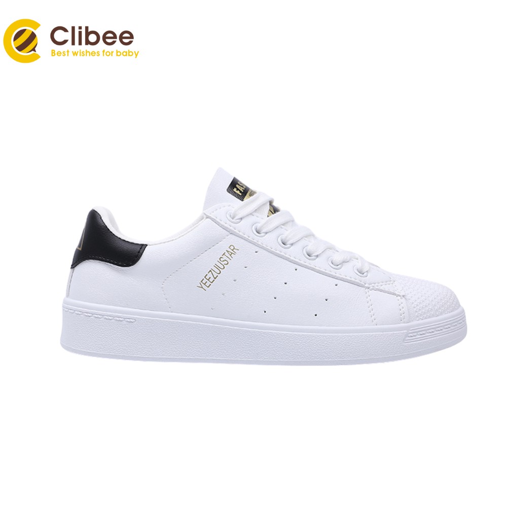 white flat tennis shoes