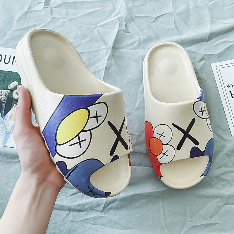 Upgrade Your Sneaker Game with KAWS x Yeezy Slides featuring Elmo Get