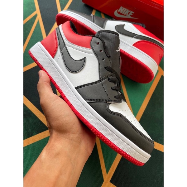 jordan 1 low red on feet