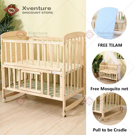 wooden cradle with mosquito net