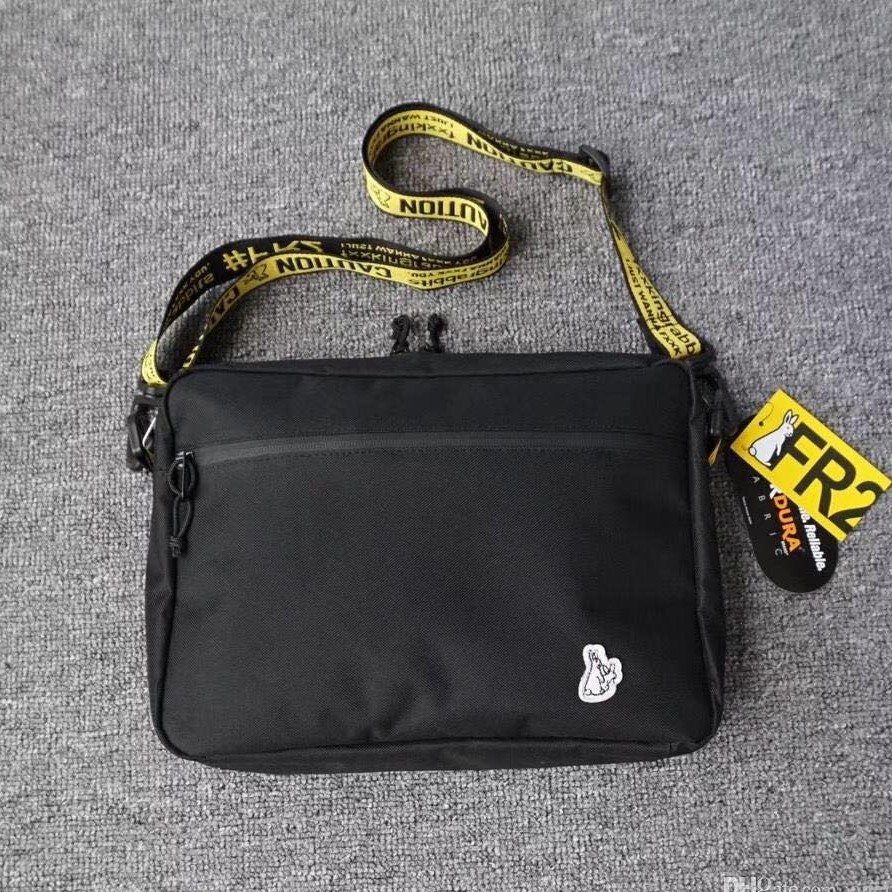 bag with yellow strap