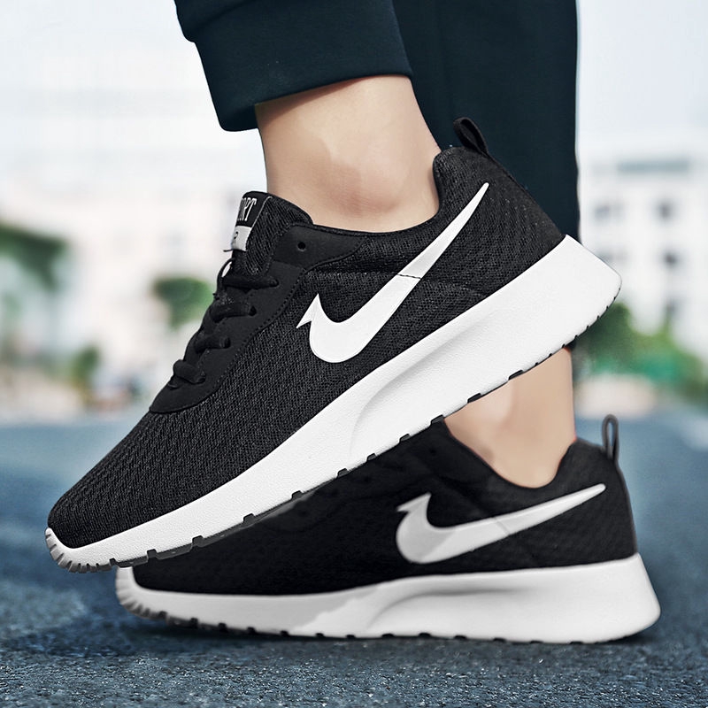 nike tanjun black white original