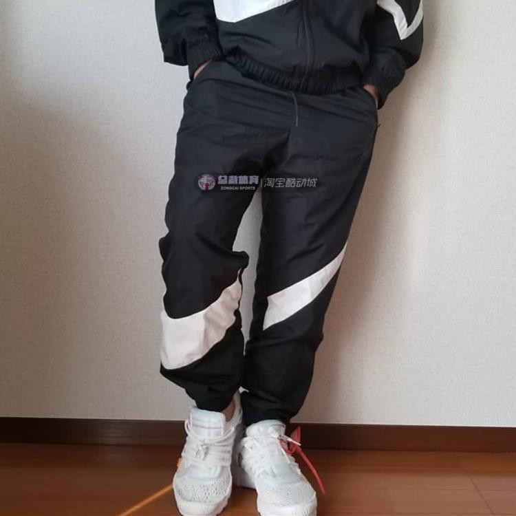 nike big swoosh woven pants