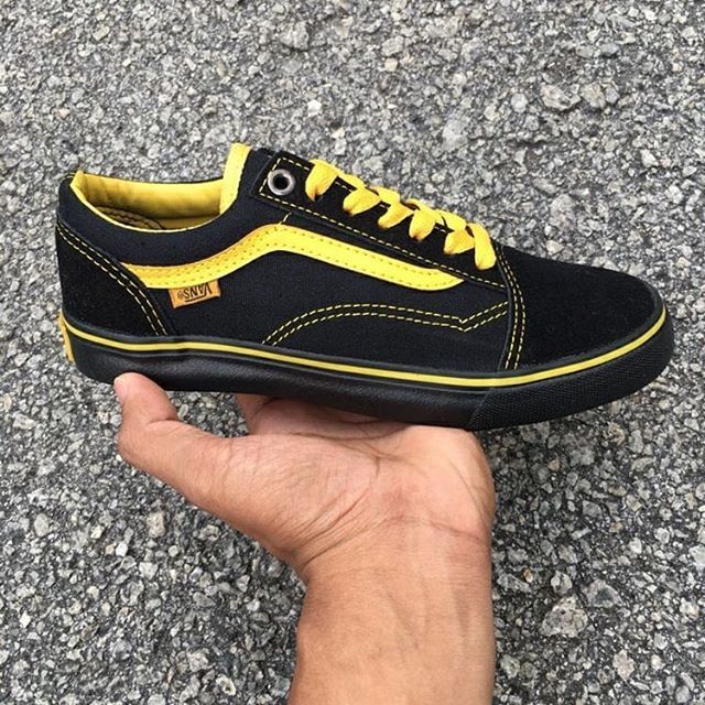 black and white checkerboard vans with yellow line