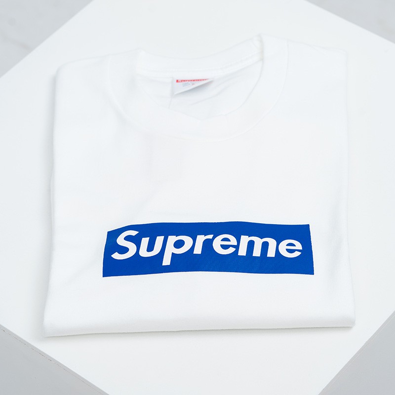 white and blue supreme shirt