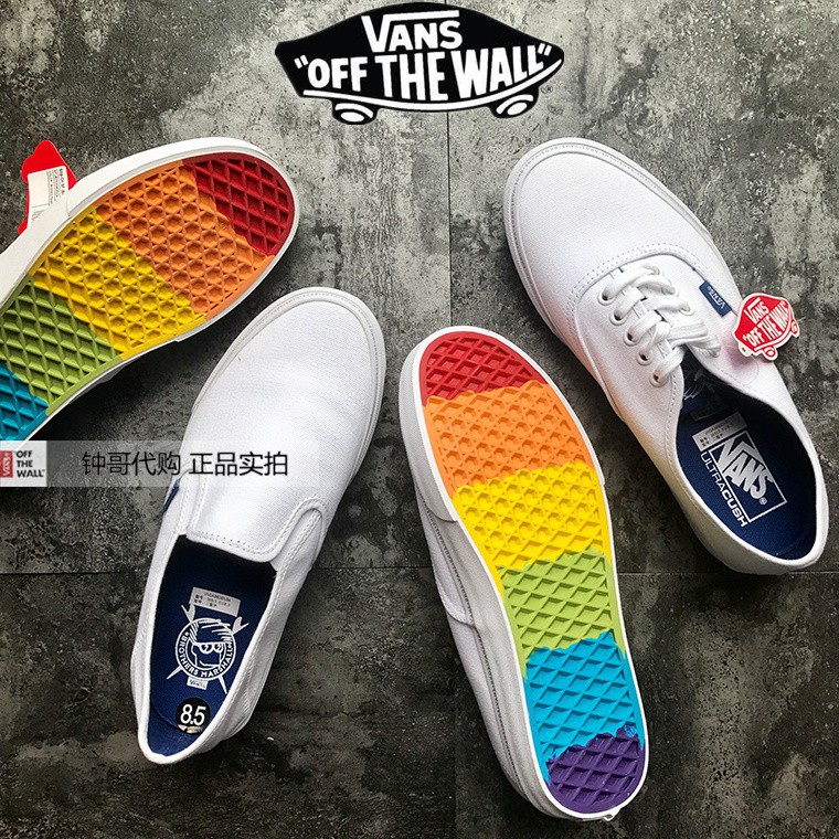 white slip on vans with rainbow bottom