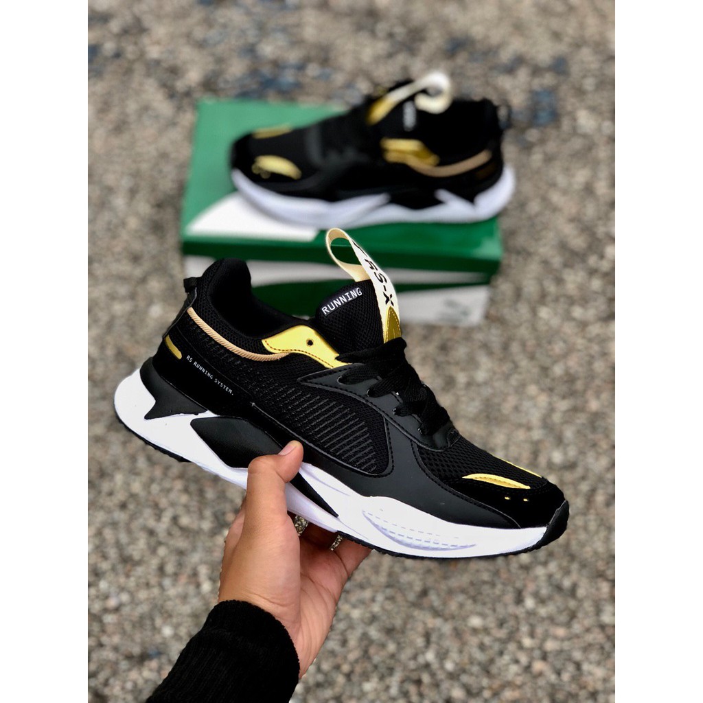 black and gold puma rsx