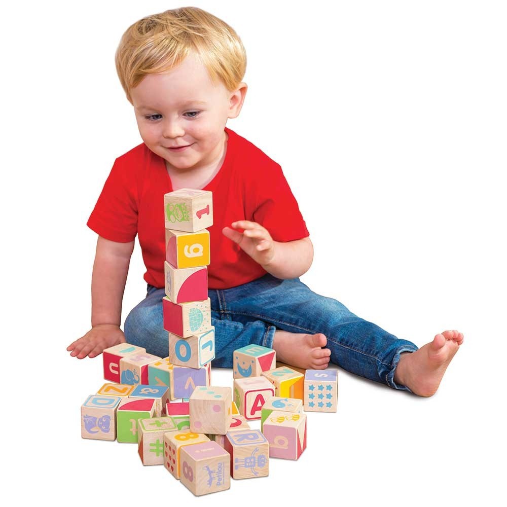 babies stacking blocks