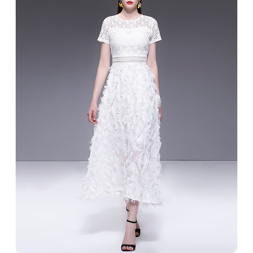 white dress with tassels on bottom