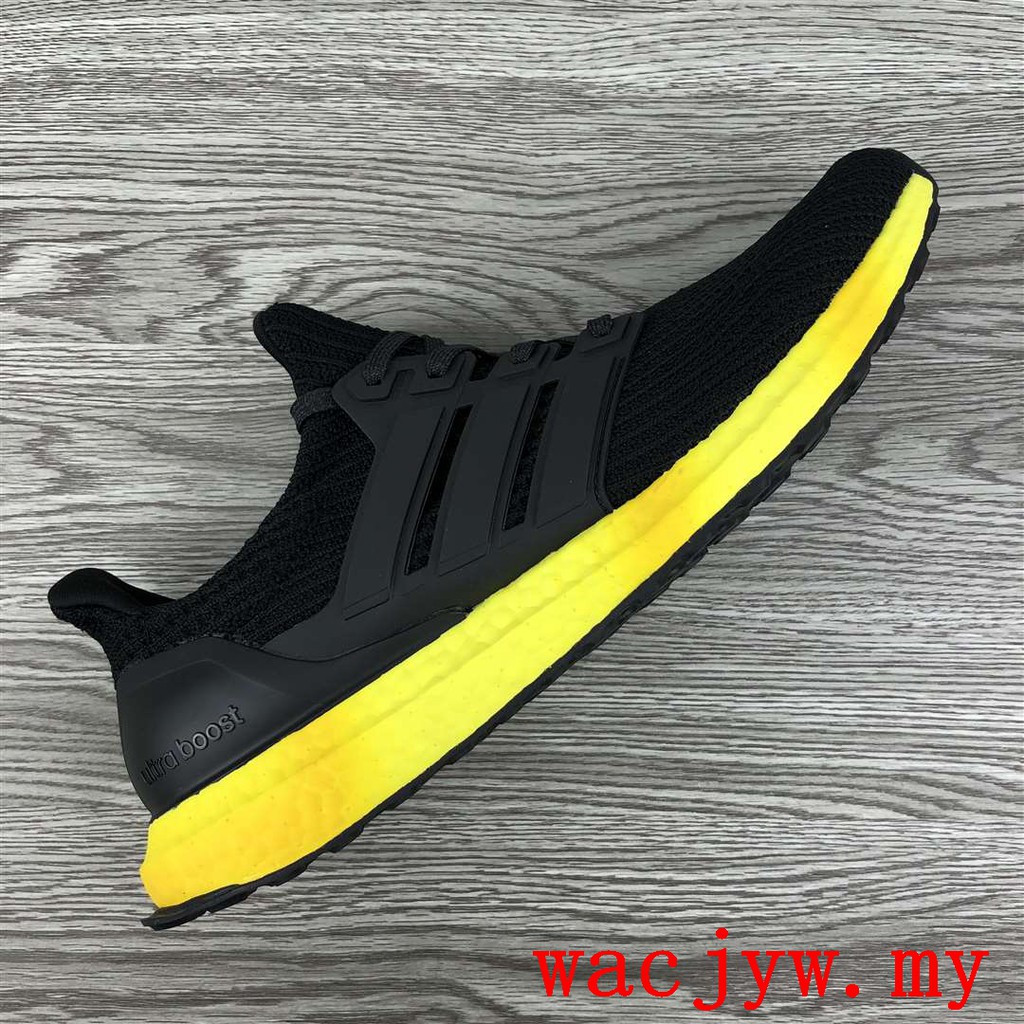 black and yellow adidas shoes