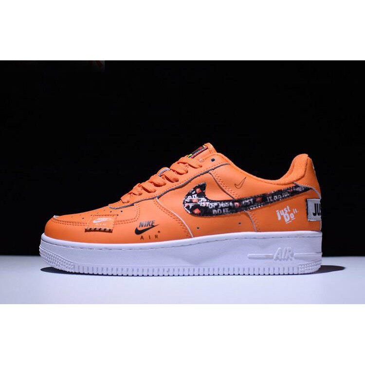 white orange and black air force ones