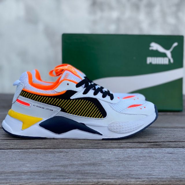 grey and orange puma shoes