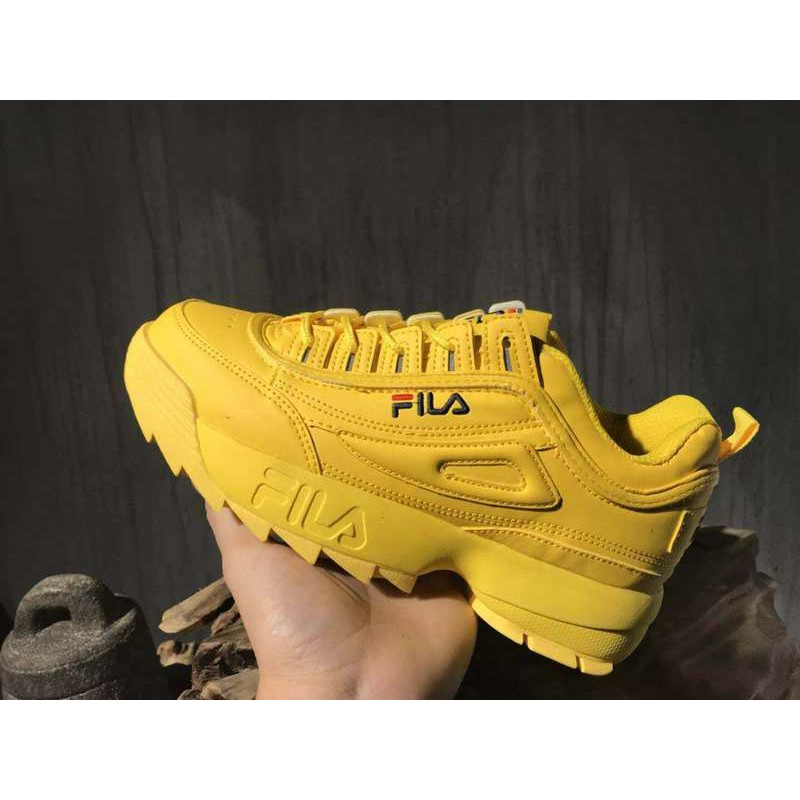 all yellow fila shoes