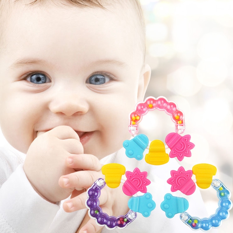 baby holding rattle