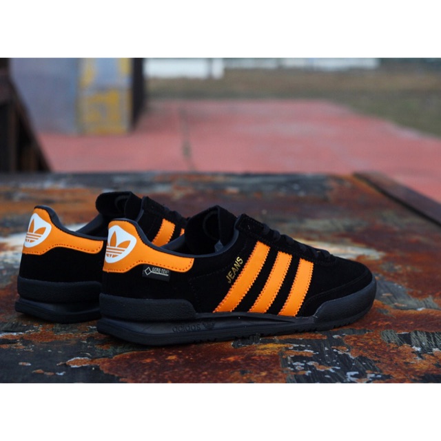 adidas jeans black and orange