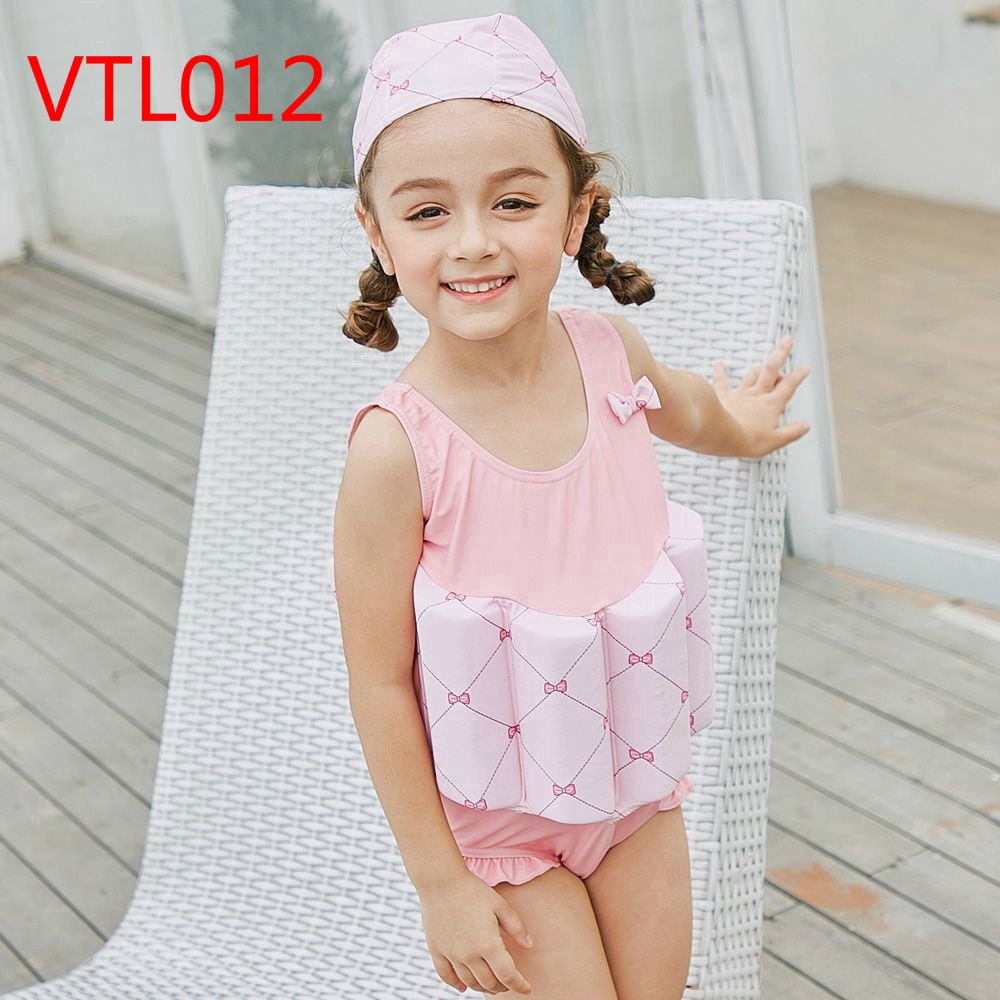 boy in girl's one piece swimsuit