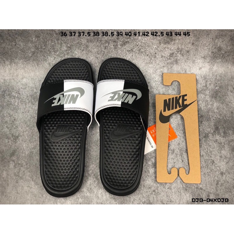 half black half white nike slides