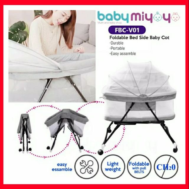 bedside bassinet connected to parents