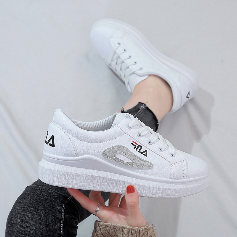 fila white flat shoes