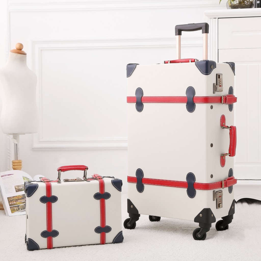 white vintage luggage