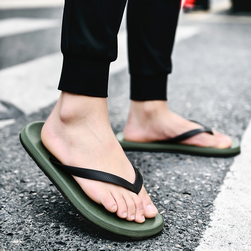 men's feet in flip flops