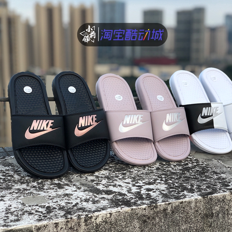 black and gold nike slippers