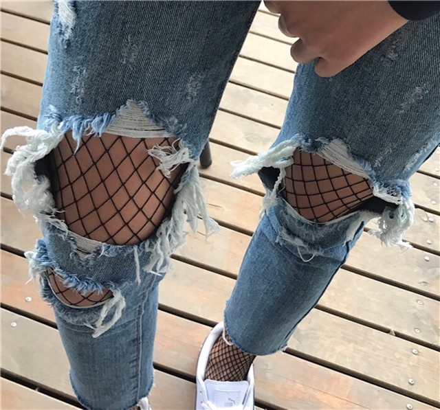 ripped jeans with net stockings