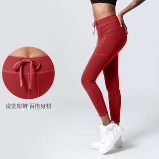 2022 spring and summer new lace-up pocket yoga pants women's high waist hip lifting jogging pants sports fitness tight cropped pants