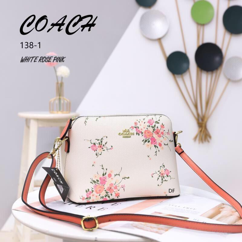 white coach purse with flowers