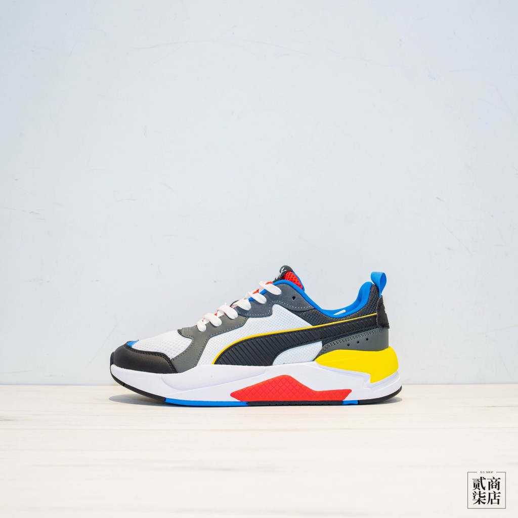 red and yellow puma shoes
