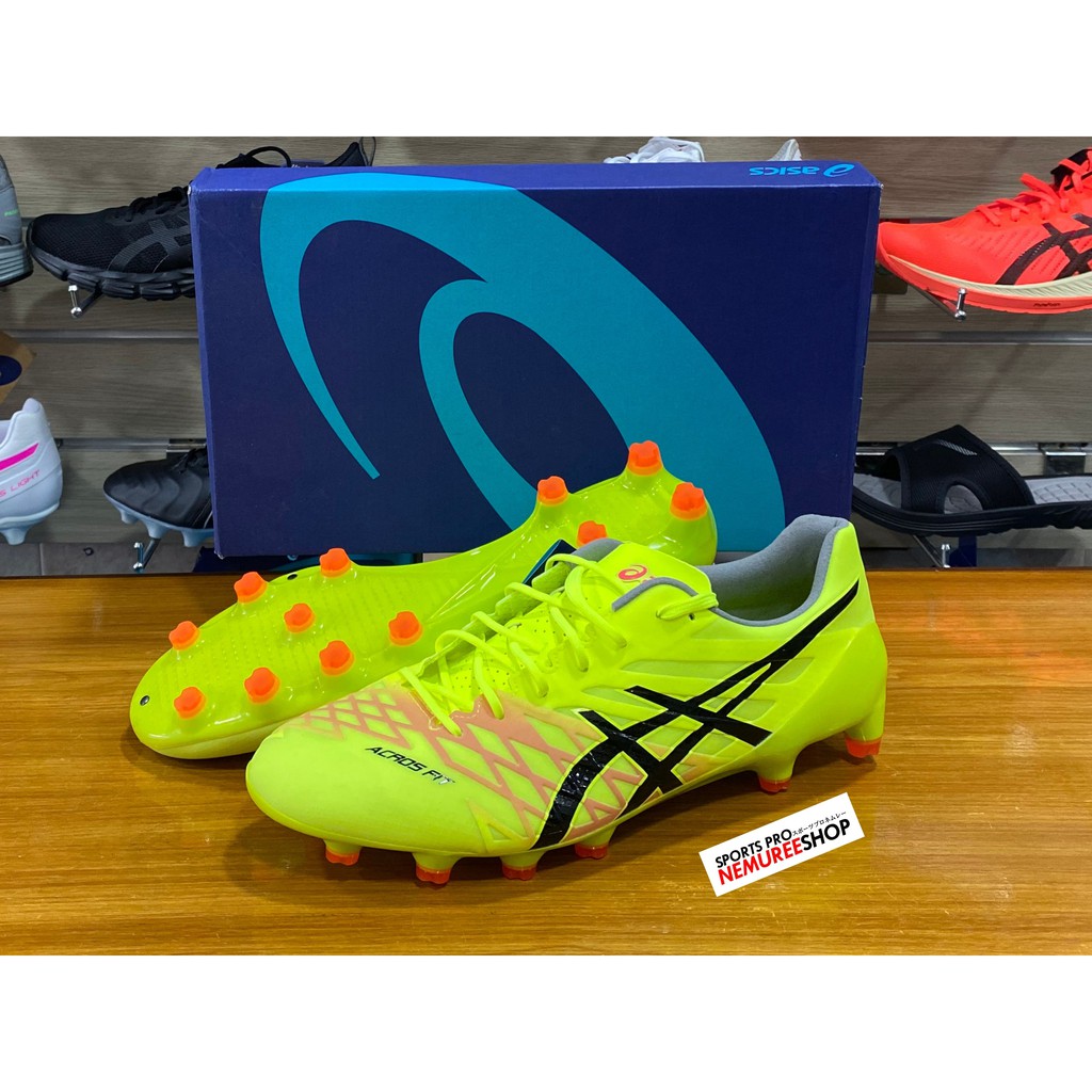 yellow asics football boots