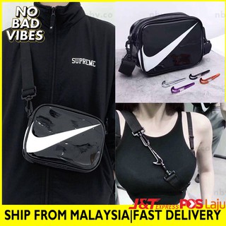 nike mini swoosh pvc sling bag