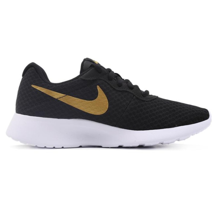 nike black and gold tennis shoes